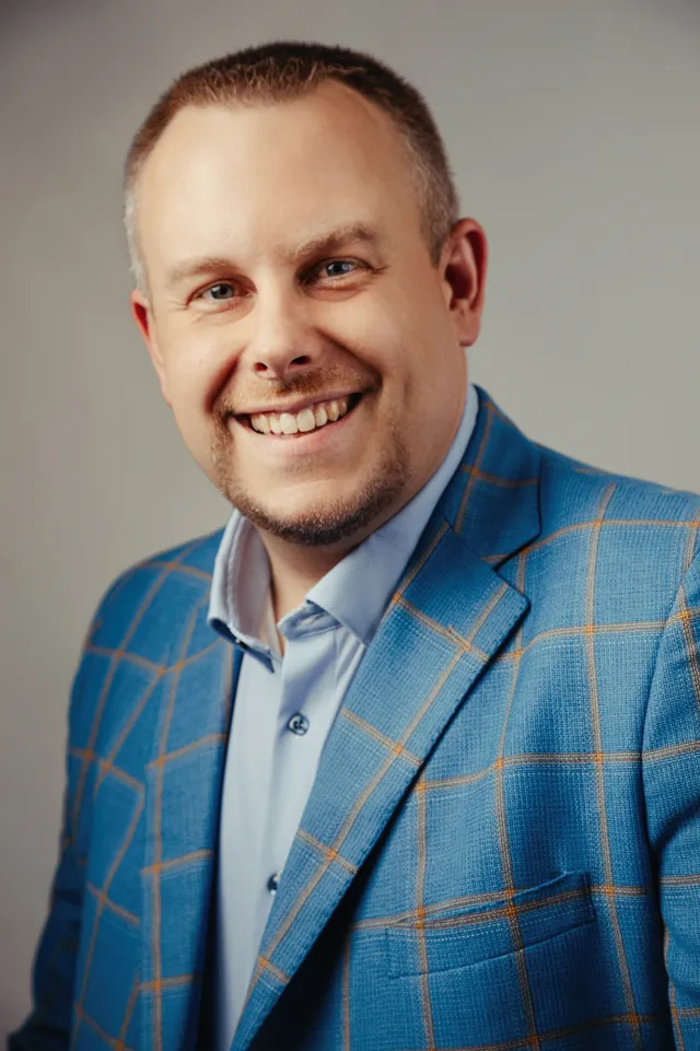 Aaron Evans, founder and CEO of Story Group, in a studio headshot